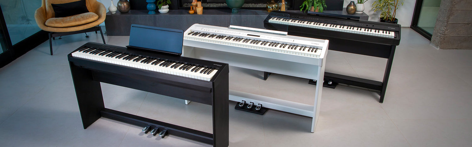 Three digital pianos kept together